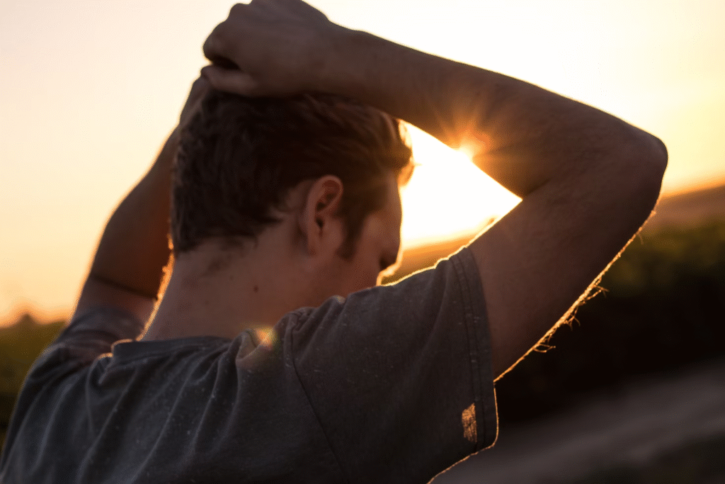 A man looks stressed and agitated while outdoors
