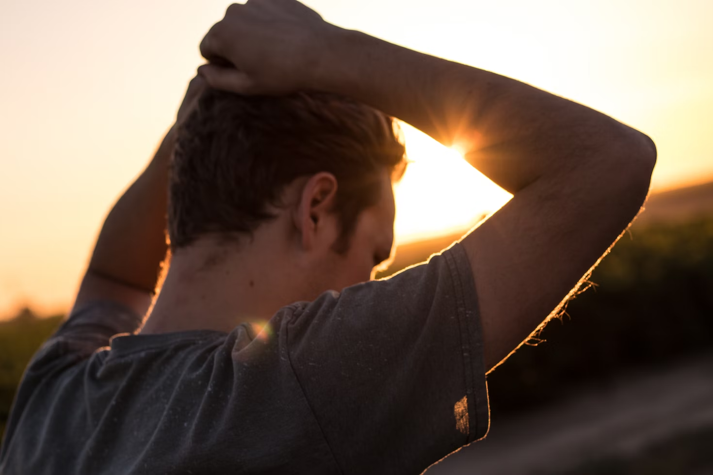 A man looks stressed and agitated while outdoors