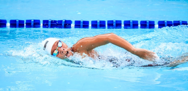 A person swimming in a swimming pool