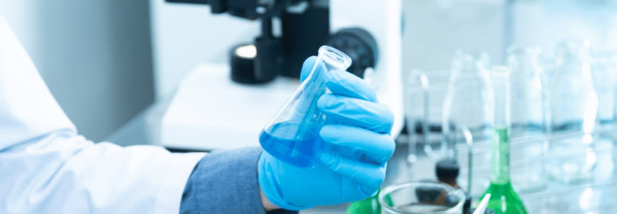 Person holding a laboratory flask