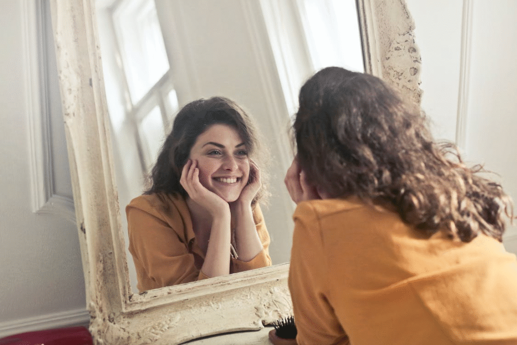 Woman smiling after getting Hormone Replacement Therapy