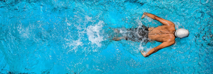 A person swimming in a swimming pool