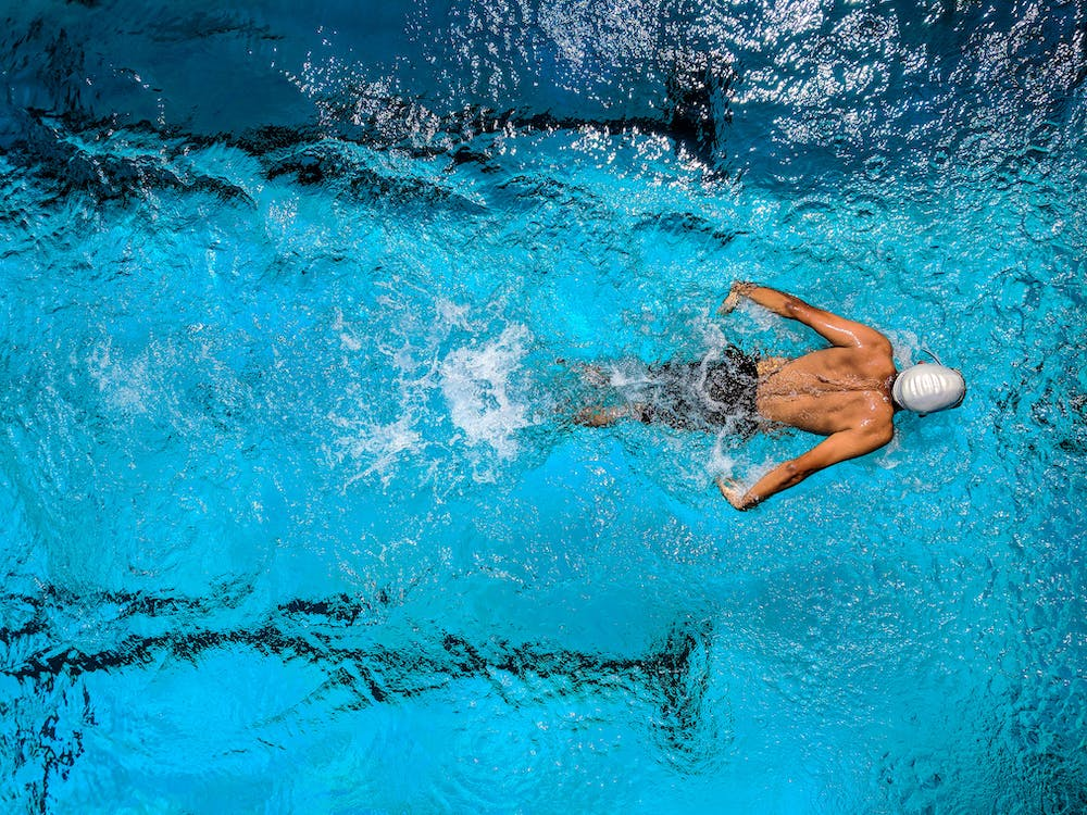 A person swimming in a swimming pool